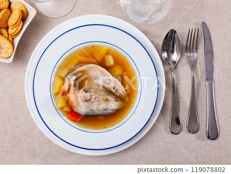 Fish soup with salmon bones and vegetables 119078802