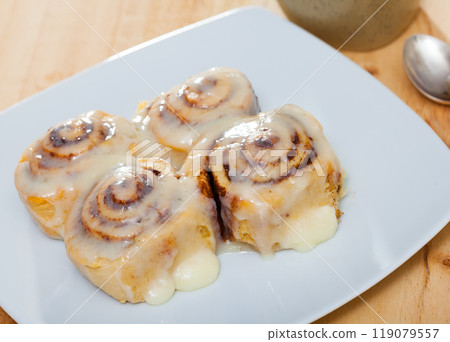 Vegan cinnabon rolls with topping Vegan cinnabon rolls with topping 119079557