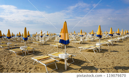 Umbrellas on the beach of Lido di Jesolo near Venice, Veneto region, Italy. Umbrellas on the beach of Lido di Jesolo near Venice, Veneto region, Italy. 119079870