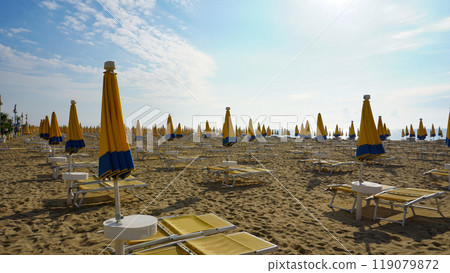 Umbrellas on the beach of Lido di Jesolo near Venice, Veneto region, Italy. Umbrellas on the beach of Lido di Jesolo near Venice, Veneto region, Italy. 119079872