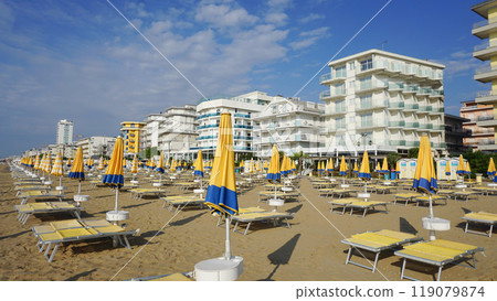 Umbrellas on the beach of Lido di Jesolo near Venice, Veneto region, Italy. Umbrellas on the beach of Lido di Jesolo near Venice, Veneto region, Italy. 119079874