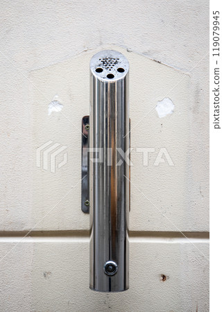 Chrome ashtray at the facade of the building Chrome ashtray at the facade of the building 119079945