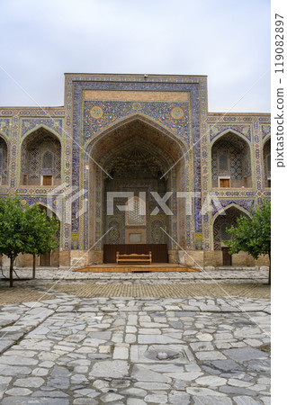 Courtyard of the Ulugbek Madrasah of 14 century in Samarkand, Uzbekistan with decorated portal 119082897