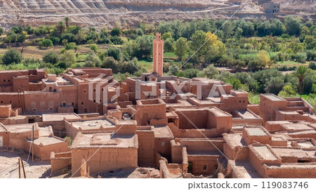 Erfoud town in the Tafilalet oasis, a tranquil desert town in Morocco surrounded by lush palm trees, blending natural beauty with traditional Moroccan architecture. Erfoud town in the Tafilalet oasis, a tranquil desert town in Morocco surrounded by lush palm trees, blending natural beauty with traditional Moroccan architecture. 119083746