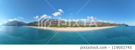 Panoramic view of Cirali beach in Antalya, Turkey, features the Mediterranean's beauty with clear blue sea, lush green forests, and majestic mountains, a top spot for tourists. Panoramic view of Cirali beach in Antalya, Turkey, features the Mediterranean's beauty with clear blue sea, lush green forests, and majestic mountains, a top spot for tourists. 119083748
