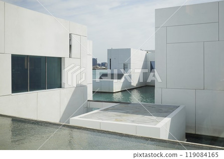 Abstract white minimalistic building with swimming pool inside Abstract white minimalistic building with swimming pool inside 119084165