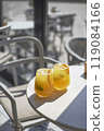 Sunny orange iced drinks in a cafe 119084166