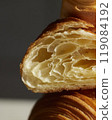 One plain croissant flaky layers with hard light 119084192