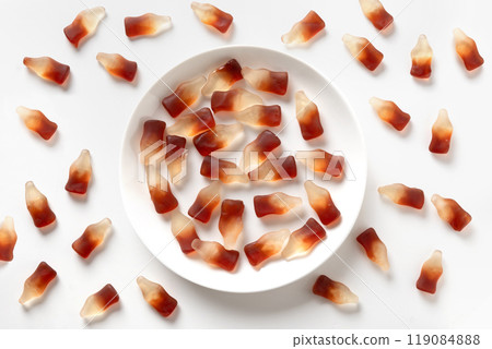Gummy jellies in shape of soda bottles on white background. 119084888