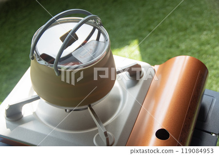 Boiling water with a portable stove Outdoor Disaster preparedness Boiling water with a portable stove Outdoor Disaster preparedness 119084953