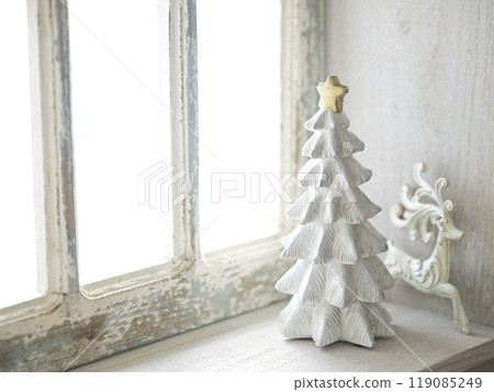 Christmas tree on an antique windowsill 119085249