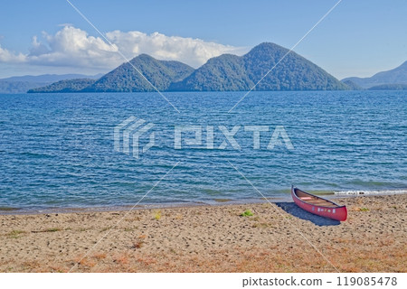 Canoes waiting for their turn on Lake Toya Canoes waiting for their turn on Lake Toya 119085478