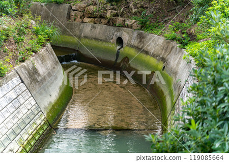 Nesube River, near Ishibiya Bridge, a concrete-banked river running through the city, Tomigusuku City, Okinawa Prefecture Nesube River, near Ishibiya Bridge, a concrete-banked river running through the city, Tomigusuku City, Okinawa Prefecture 119085664