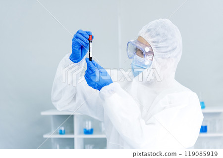 Scientist man holding sample blood test tube in science laboratory. Doctor clinic healthcare technician lab testing blood sample diagnosis. Asian man scientist working in hiv testing medical lab. Scientist man holding sample blood test tube in science laboratory. Doctor clinic healthcare technician lab testing blood sample diagnosis. Asian man scientist working in hiv testing medical lab. 119085919