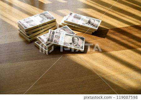 A stack of bills on a table (new bill version) 119087598