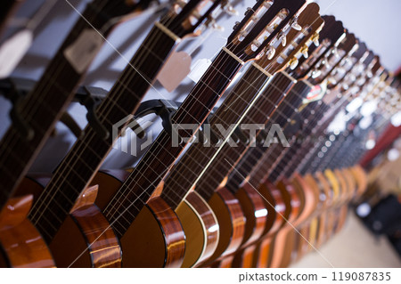 long line of new acoustic guitars in store long line of new acoustic guitars in store 119087835