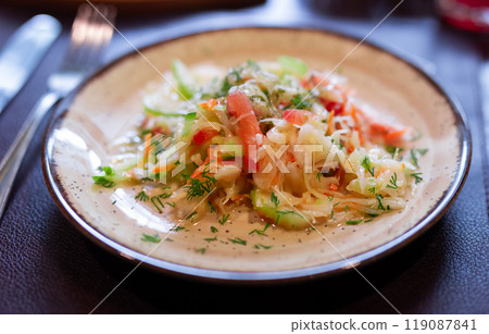 Plate with fresh vegetable salad of tomato, cucumber and celery close up Plate with fresh vegetable salad of tomato, cucumber and celery close up 119087841