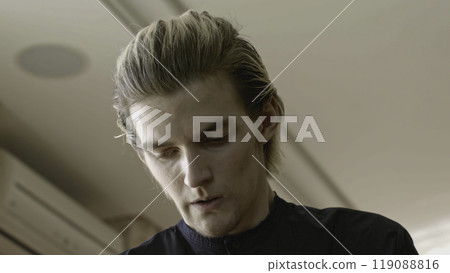 Close-up of man worried and worried. Stock. Attractive young man is emotionally stressed and anxious. Man with different emotions is experiencing stress from situation that happened Close-up of man worried and worried. Stock. Attractive young man is emotionally stressed and anxious. Man with different emotions is experiencing stress from situation that happened 119088816