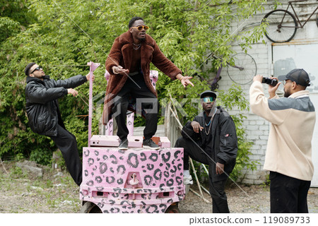 Posing with Pink Leopard Print Cart Outdoors 119089733