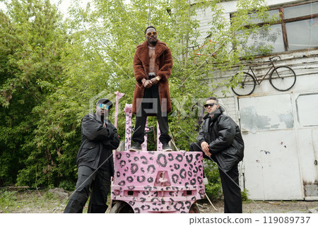 Posing Around Bright Painted Military Vehicle With Leopard Prints Posing Around Bright Painted Military Vehicle With Leopard Prints 119089737