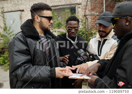 Discussing Plans in Outdoor Urban Setting Discussing Plans in Outdoor Urban Setting 119089750