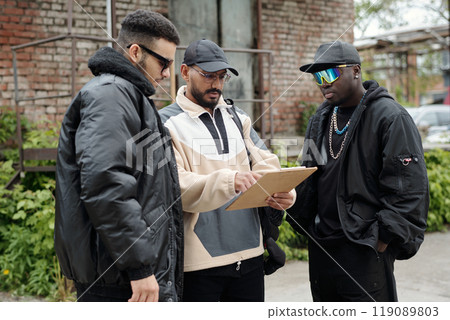 Discussing Urban Plans in Casual Streetwear Discussing Urban Plans in Casual Streetwear 119089803