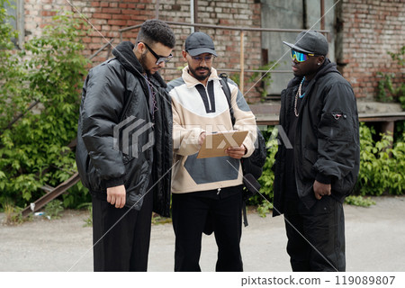 Discussing Work Plans with Colleagues Outdoors Discussing Work Plans with Colleagues Outdoors 119089807