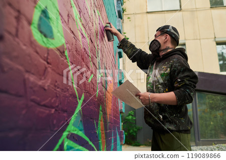 Painting graffiti artwork in the city Painting graffiti artwork in the city 119089866