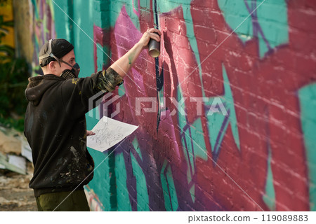 Working over new graffiti masterpiece 119089883