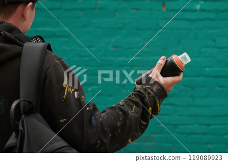 Graffiti artist holding can with paint 119089923