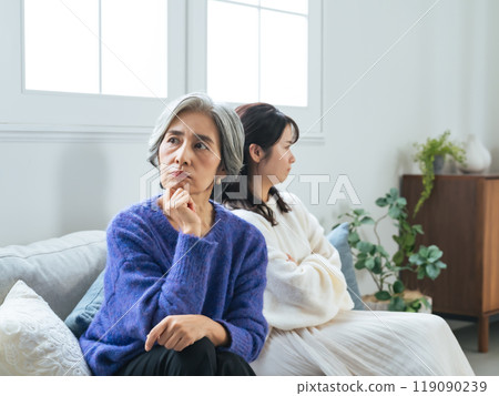 Fighting elderly mother and young daughter Fighting elderly mother and young daughter 119090239