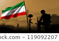 The silhouette of an Iranian soldier weeps for the loss of a comrade in battle, with a large flag waving 119092207