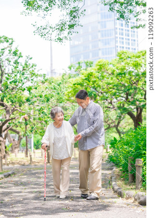 Senior woman, middle-aged man, parent and child walking 119092263