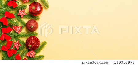 Set of festive balls, fir tree and Christmas decorations on colorful background. Top view of New Year ornament concept with copy space 119093975