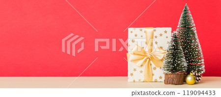 Christmas composition. craft Gift box, small tree, branches and craft DIY decorations on white background. New year concept. Christmas home decoration Flat lay, top view, copy space 119094433