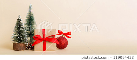 Christmas composition. Gifts, small tree, branches and craft DIY decorations on white background. New year concept. Christmas home decoration Flat lay, top view, copy space 119094438
