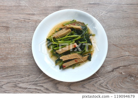 fried Chinese kale with slice gluten vegetarian food on plate  119094679