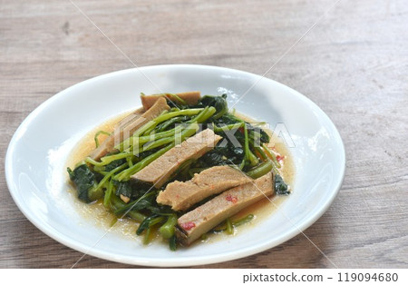 fried Chinese kale with slice gluten vegetarian food on plate  119094680