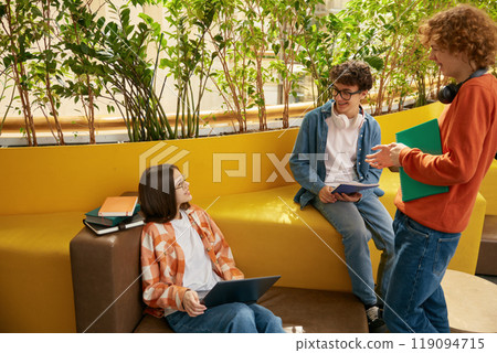 Group of teenagers in coworking office Group of teenagers in coworking office 119094715