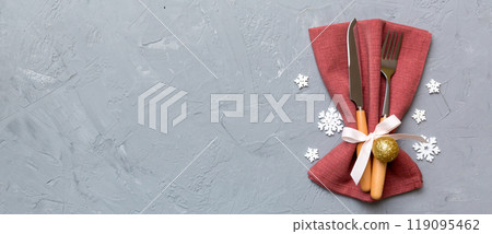 Christmas table place setting with knife, napkin and fork. Holidays new year background with copy space 119095462