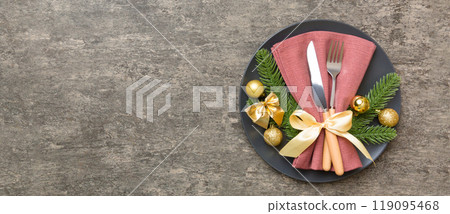 Christmas table place setting with christmas decor and plates, kine, fork and spoon. Christmas holiday background. Top view with copy space 119095468