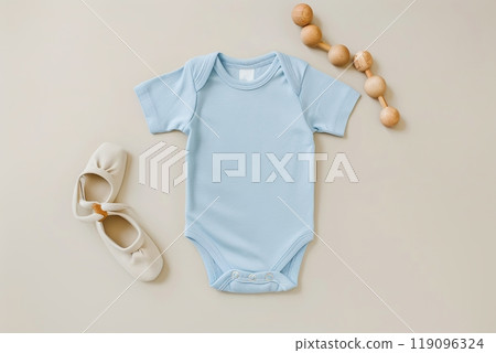 Baby boy clothes on beige pastel background. Fashion newborn clothes. Flat lay, top view. Baby kids soft clothing set, wooden toys. Infant bodysuit made of organic eco friendly cotton. Gender neutral 119096324