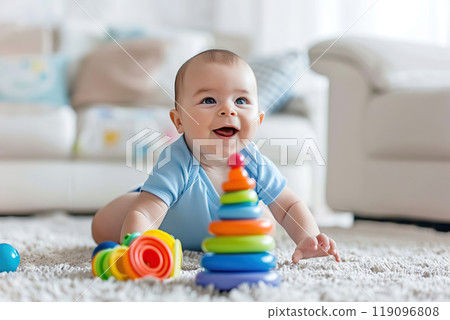 Kid girl play toys at home, kindergarten or nursery. Baby child playing playthings cubes and wood puzzle, pyramid sitting on the floor. Happy preschool education indoor. 3 years old little toddler. 119096808