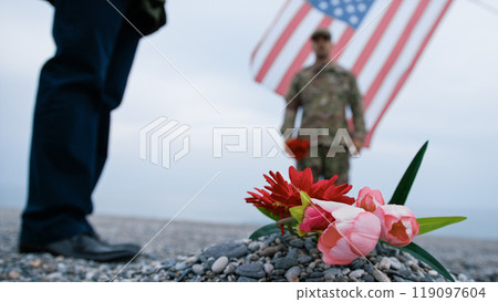 Soldier Paying Tribute To A Tomb At The Beach 119097604