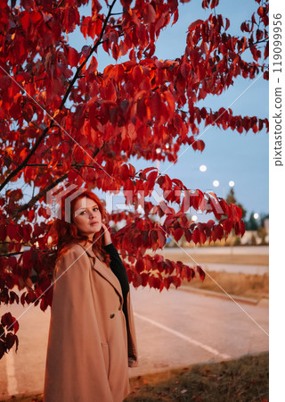Portrait of beautiful red-haired woman merging with nature 119099956