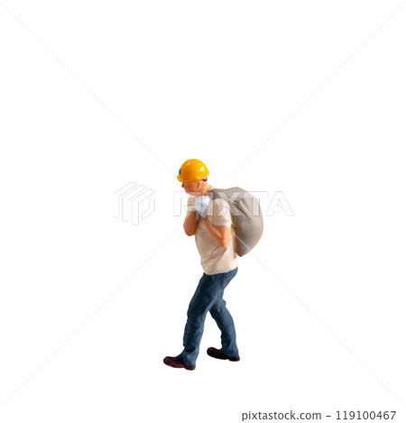Miniature construction worker carrying a heavy sack on his back isolate on white background with clipping path Miniature construction worker carrying a heavy sack on his back isolate on white background with clipping path 119100467
