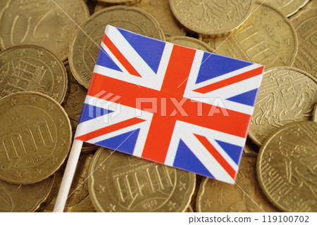 United Kingdom flag on gold coins money, finance trading investment business currency. United Kingdom flag on gold coins money, finance trading investment business currency. 119100702
