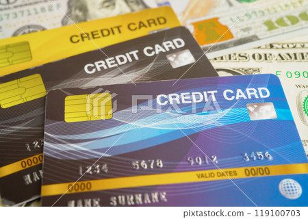 Credit card on US dollar banknotes, finance economy trading shopping online business. Credit card on US dollar banknotes, finance economy trading shopping online business. 119100703