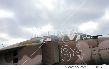 Cabin of a two-seat military bomber under gray cloudy sky stock photo  119101263