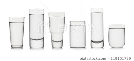 Stil natural mineral water in various shape and size glasses on white background. 119101739